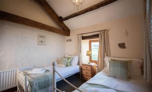 Кровать или кровати в номере Garth Cottage, Castle Carrock, Nr Carlisle