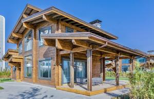 a wooden house with a roof at Eco Village in Samarkand