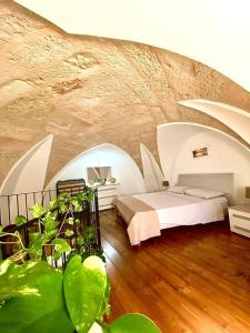 a bedroom with a bed in a large room at Casa Tramonto in Alliste