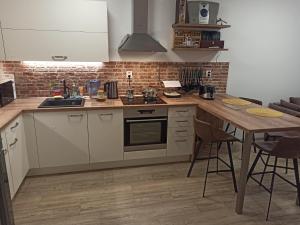 Kuchyň nebo kuchyňský kout v ubytování Severan New Appartement 2 + 6 fotografií