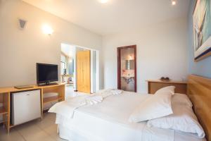 Postel nebo postele na pokoji v ubytování Wetiga Hotel