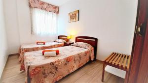 Postel nebo postele na pokoji v ubytování Apartamentos Navarra 08 Familidays