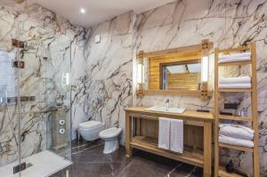 a bathroom with a sink and a toilet and a shower at Eco Village in Samarkand