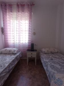 Łóżko lub łóżka w pokoju w obiekcie Apartment in La Zenia