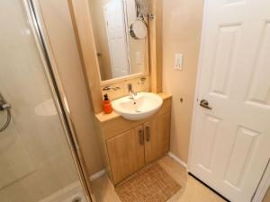 a bathroom with a sink and a shower at Rosie's Zen Den in Carlisle +24 photos