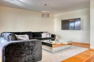 a living room with a couch and a table at Villa 58, a Home in Madeira in Santa Cruz