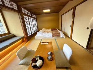 Voodi või voodid majutusasutuse Arifuku Onsen Yoshidaya toas