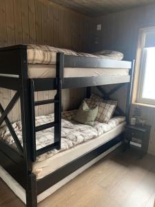 a couple of bunk beds in a room at Bualie Golsfjellet in Gol