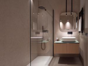 a bathroom with a sink and a glass shower at Villa Favorita Hotel & Events in Marsala