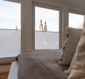 Postel nebo postele na pokoji v ubytování St. Salvator Apartments