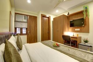 Postel nebo postele na pokoji v ubytování Hotel TMS Grand