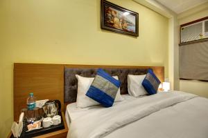 Postel nebo postele na pokoji v ubytování Hotel TMS Grand