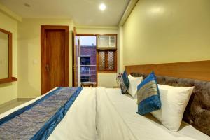 Postel nebo postele na pokoji v ubytování Hotel TMS Grand