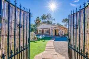 an entrance to a house through an iron gate at Ideal Property Mallorca - Villa Jardi in Alcudia