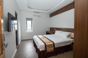 Postel nebo postele na pokoji v ubytování Nhà Nghỉ Ngọc Anh
