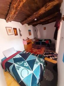 Postel nebo postele na pokoji v ubytování Ranch de Sidi kaouki