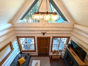 an overhead view of a living room with a large window at Black Bear Cabin 3 in Whitefish