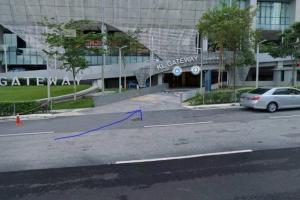 a car parked in a parking lot in front of a building at [PROMO]Connected train 2 Bedroom ABOVE MALL (22) in Kuala Lumpur