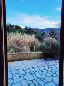 a view from a window of a patio at U caseddu in Santa-Maria-Siché