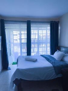 Postel nebo postele na pokoji v ubytování Ruaka studio Airbnb
