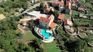 an aerial view of a house with a swimming pool at Magnificent Villa Olka With Private Pool and Sauna in Žeževica