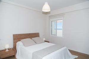 Posteľ alebo postele v izbe v ubytovaní UHC COSTA PINOSMAR APARTMENTS
