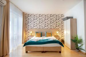 Postel nebo postele na pokoji v ubytování Prince Apartments