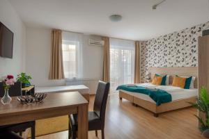Postel nebo postele na pokoji v ubytování Prince Apartments