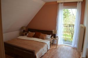 เตียงในห้องที่ Pension Lübeck