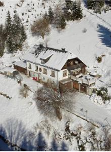 an aerial view of a house in the snow at Apartment Peterl in Alpl