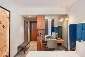 Postel nebo postele na pokoji v ubytování HYPERION Hotel München + 37 fotografií
