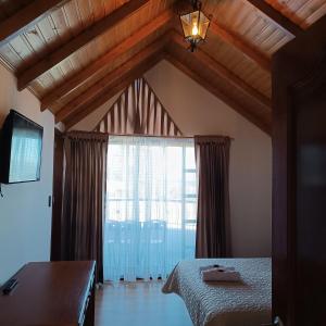 Ένα ή περισσότερα κρεβάτια σε δωμάτιο στο Villa Graciela I