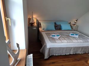 Postel nebo postele na pokoji v ubytování Bella Nautica Balatonkenese