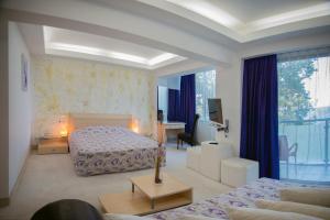 Postel nebo postele na pokoji v ubytování Dodo Beach Hotel