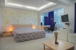 Postel nebo postele na pokoji v ubytování Dodo Beach Hotel