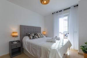 Posteľ alebo postele v izbe v ubytovaní Teatro Suites Málaga CITY FLAT
