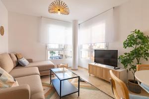 Televízia a/alebo spoločenská miestnosť v ubytovaní Teatro Suites Málaga CITY FLAT