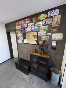 a room with a wall with signs on the wall at Chalet Sijkovsky in Stará Lesná