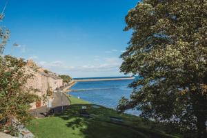 a view of a body of water with trees at The Weights and Measures Office in Berwick-Upon-Tweed +45 photos