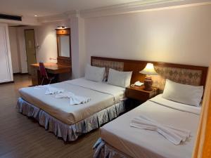 Postel nebo postele na pokoji v ubytování Jumbotel Hotel + 37 fotografií