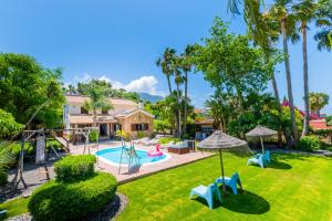 The swimming pool at or close to Cubo's Villa Llanos de la Plata