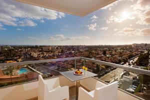 a view of a city from the balcony of a building at Hotel Gran Canaria Princess - Adults Only in Playa del Ingles
