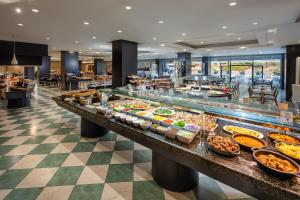 a buffet line with many different types of food at Hotel Gran Canaria Princess - Adults Only in Playa del Ingles