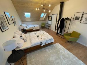 a room with two beds and a living room at Chalet Sijkovsky in Stará Lesná +39 photos