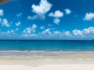 a view of the ocean with boats in the water at Tiongman Scubadive & Lodge in Tioman Island