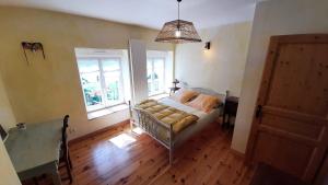 Posteľ alebo postele v izbe v ubytovaní Chez Patou - Chambres d'hôtes + 22 fotografií