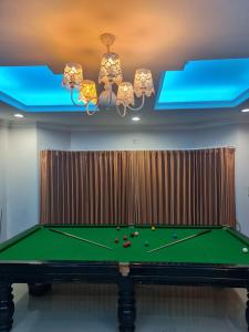 a pool table in a room with a ceiling at การ์เด้นโฮม By คุณโทนี่ 