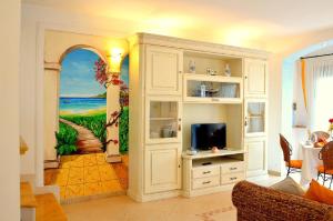 A television and/or entertainment centre at Villa Marea