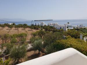 a view of the ocean from the balcony of a building at Silver Rocks Hotel in Chrissi Akti