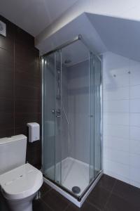 a glass shower in a bathroom with a toilet at Prazer da Natureza Resort & Spa in Caminha
